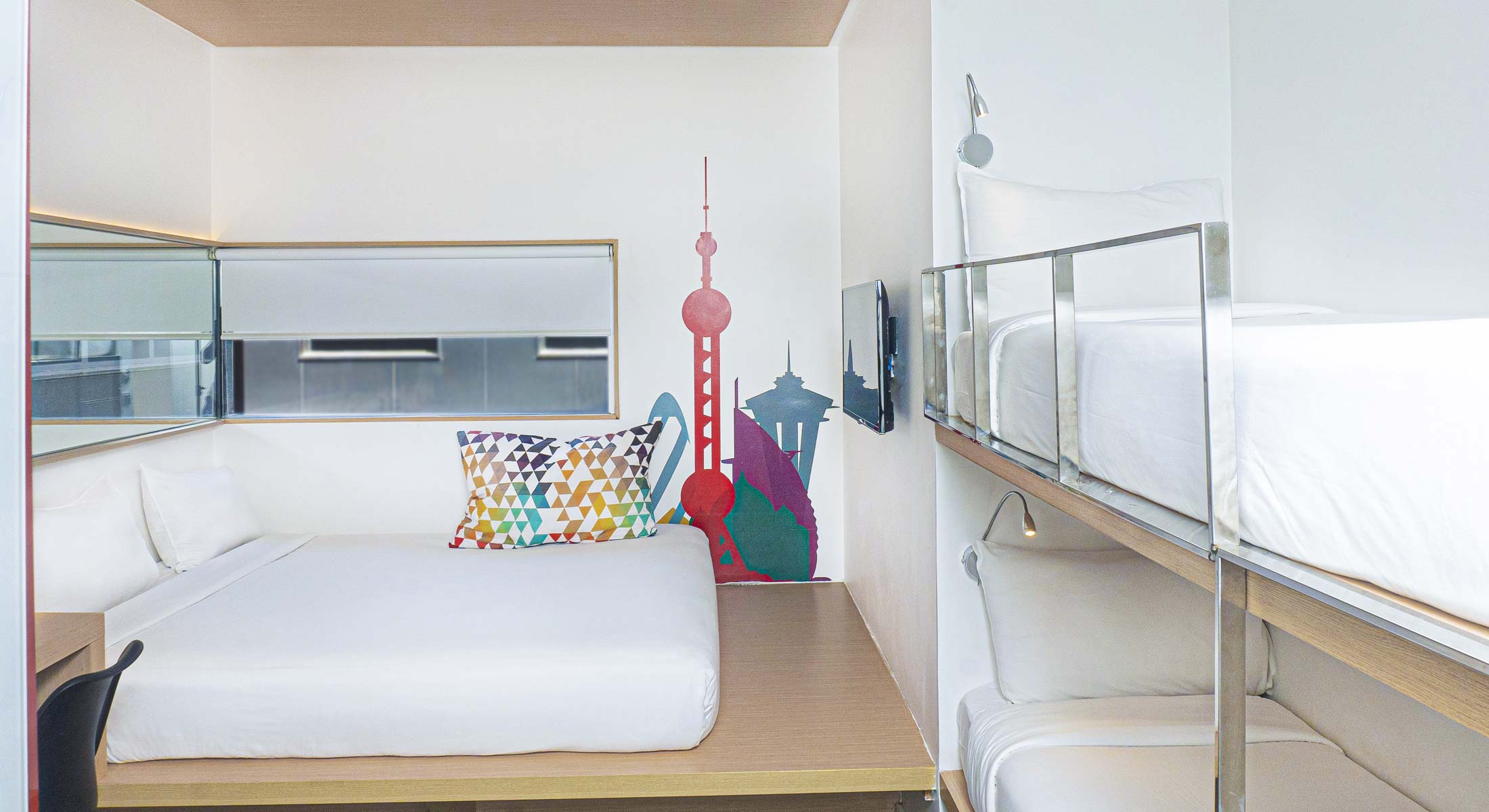 a bedroom with a bunk bed and a painting on the wall