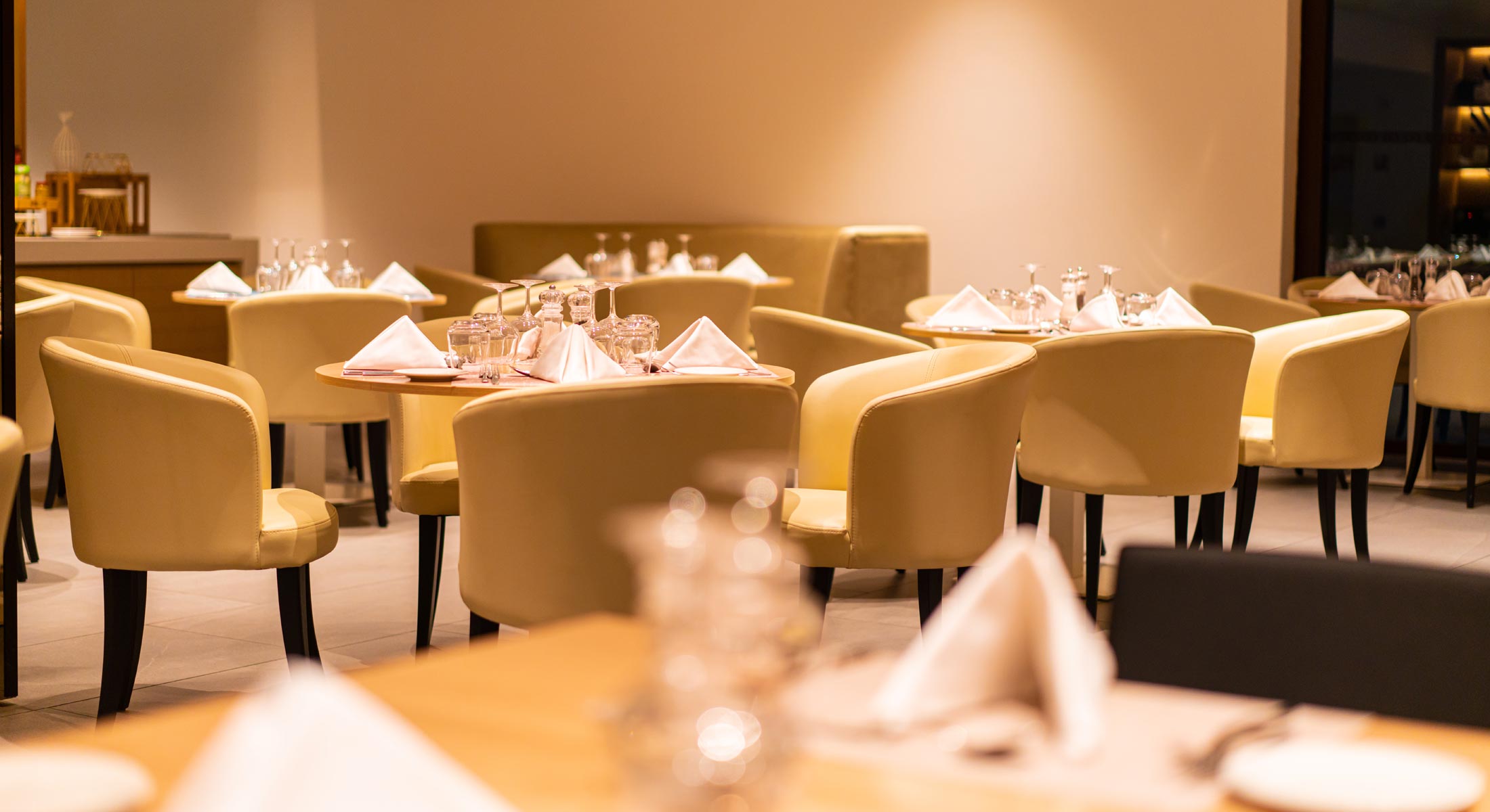 a restaurant with a lot of tables and chairs