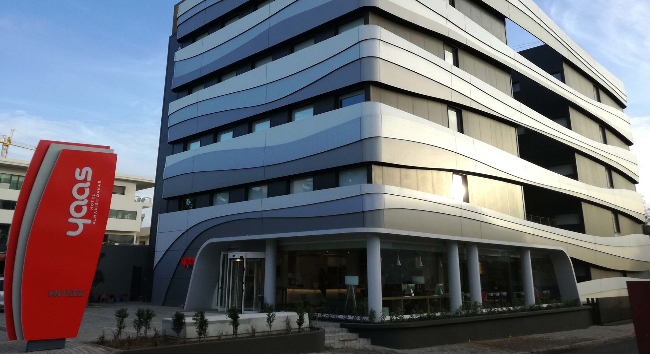 a building with a sign that says Yaas on it