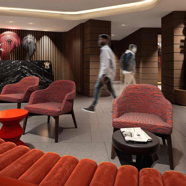 Modern hotel lobby with red-orange seating, wood accents, and reception desk.